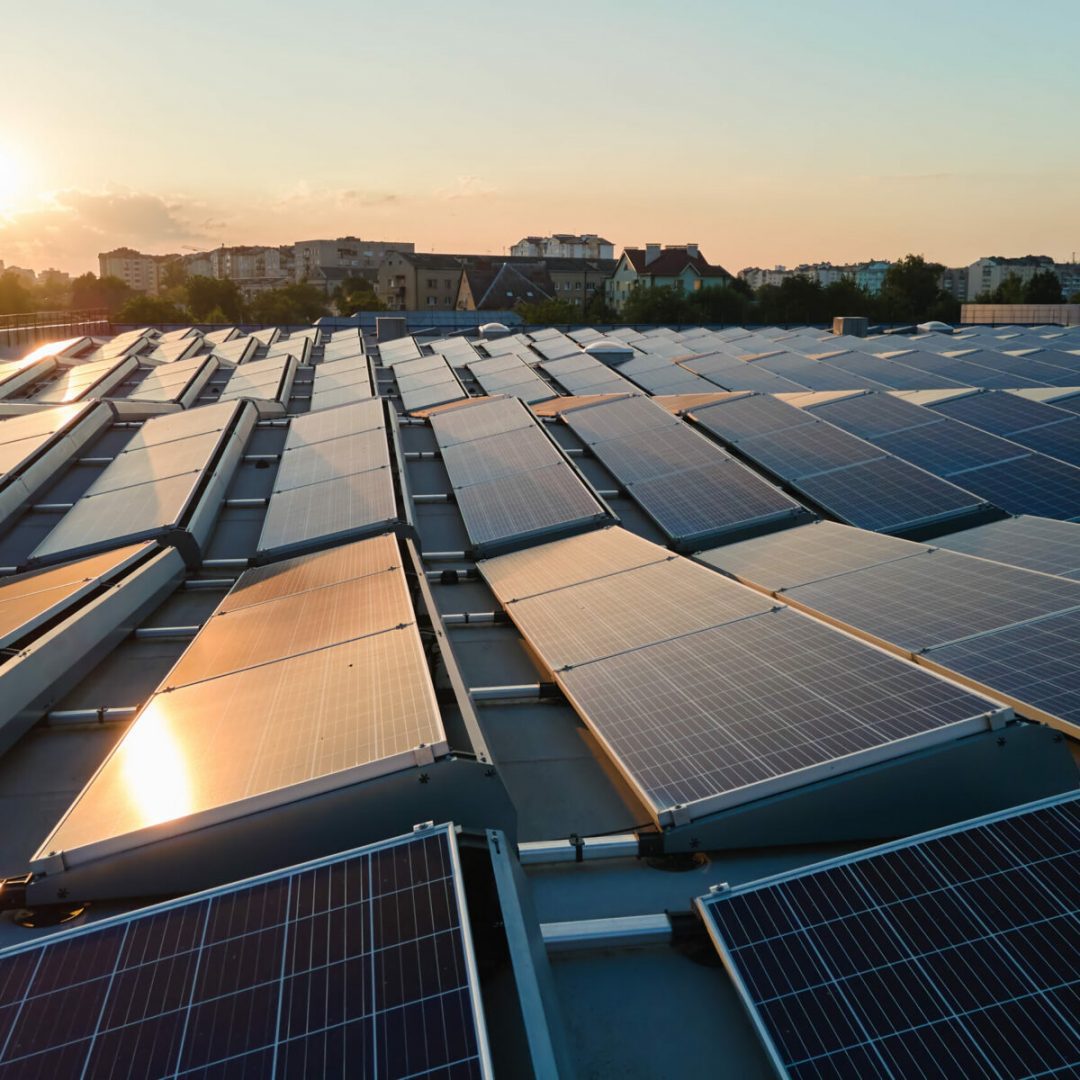 aerial-view-of-blue-photovoltaic-solar-panels-moun-2022-01-31-17-59-06-utc-scaled-1200x1200
